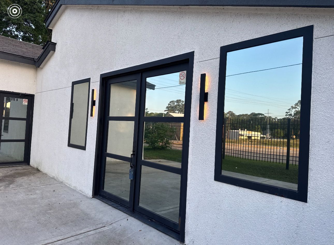 A white building with a lot of windows on it.