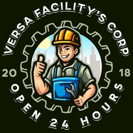 A man in a hard hat is holding a wrench and giving a thumbs up.