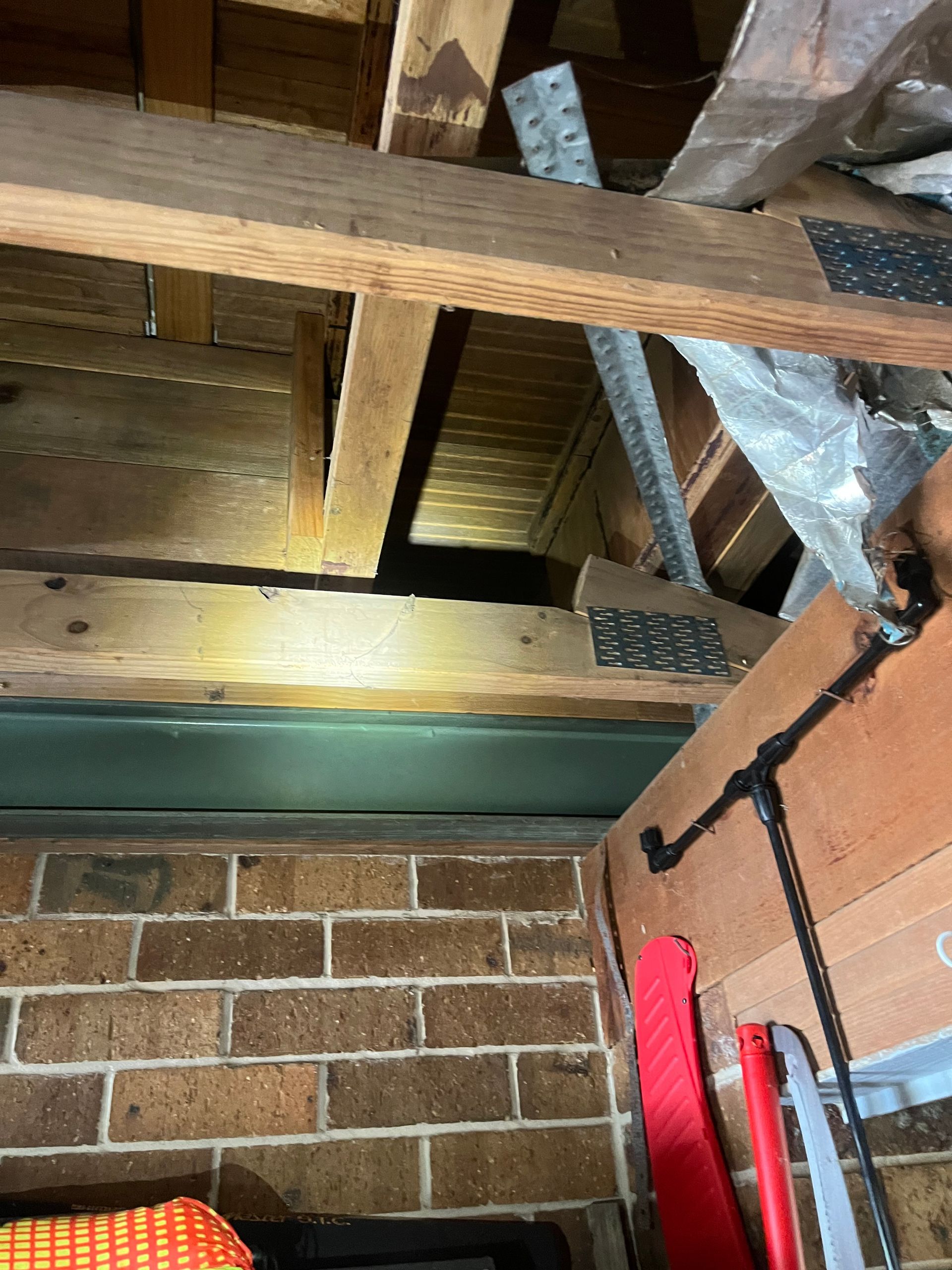 subfloor photo of many wooden beams in garage where rodents travel and enter the home. rodent rat pest control naturewise port macquarie nsw