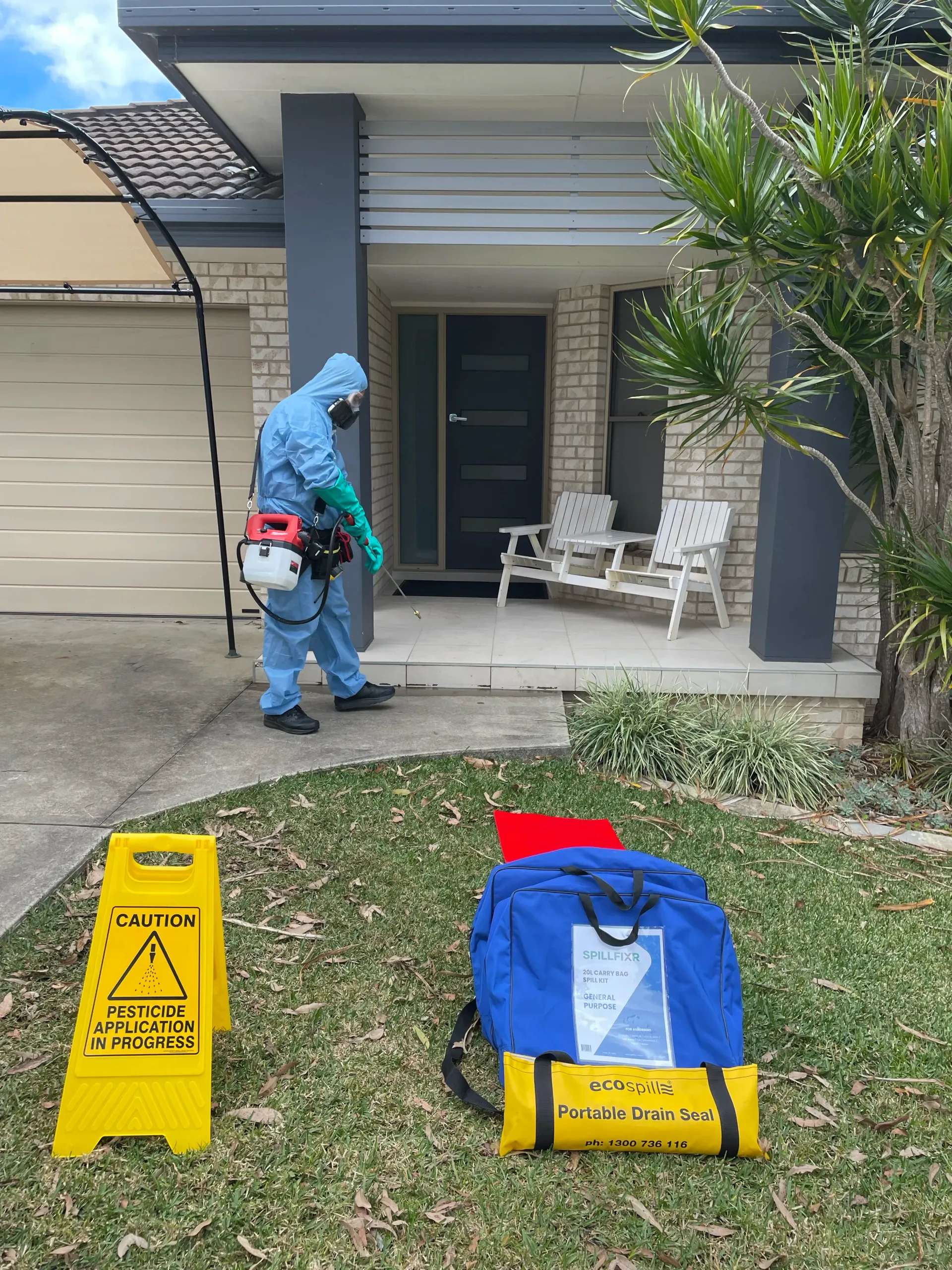 Person in Protective Suit Spraying for Pest Control — NatureWise Pest Control In Port Macquarie, NSW