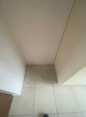 Narrow Space With Tiled Floor and Off-white Walls — NatureWise Pest Control In Port Macquarie, NSW