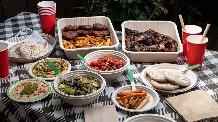 A Table Covered in Food, Including Grilled Meat — NatureWise Pest Control In Port Macquarie, NSW