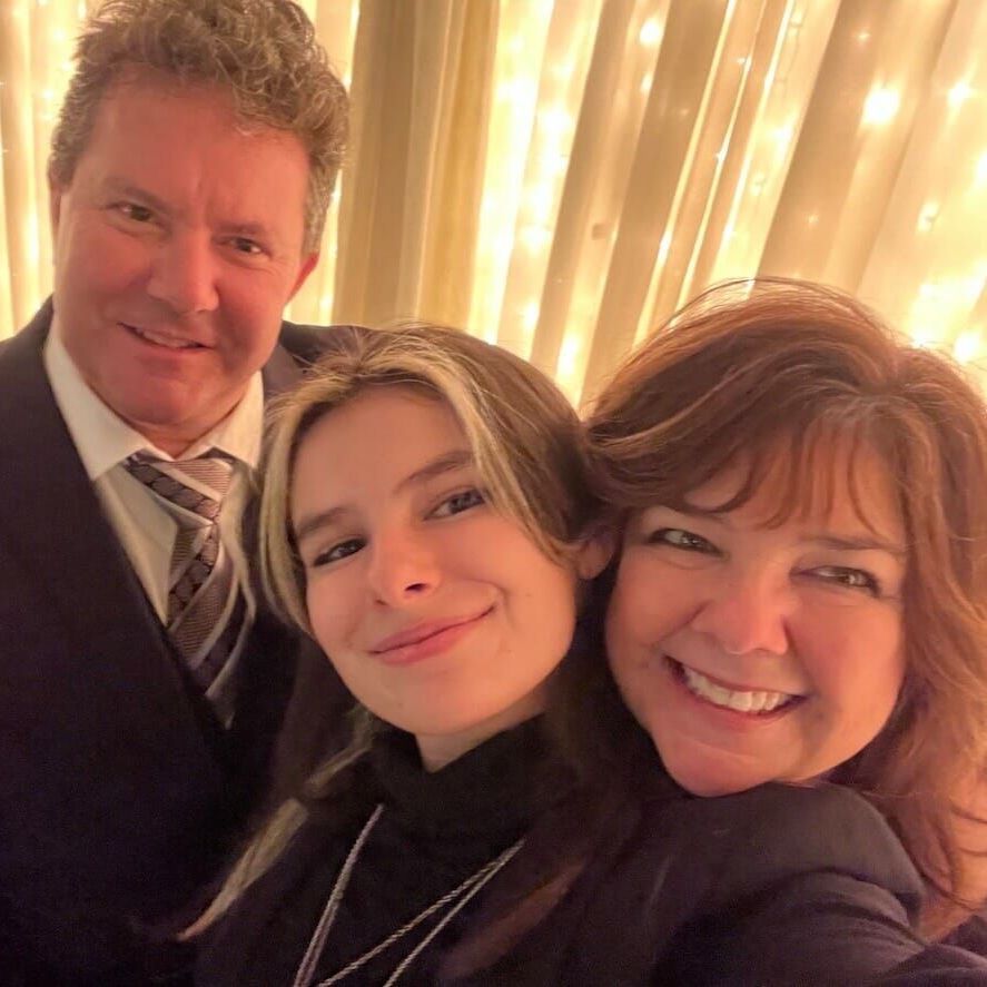 A man and two women are posing for a picture together - Claudia, Eddie and Abby Loens