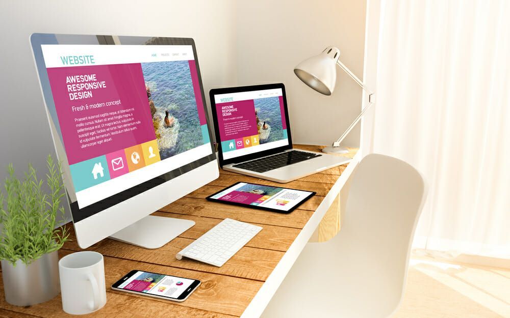 website responsive concept on devices electronic devices on desk