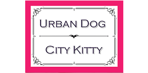 A pink and white logo for urban dog city kitty.