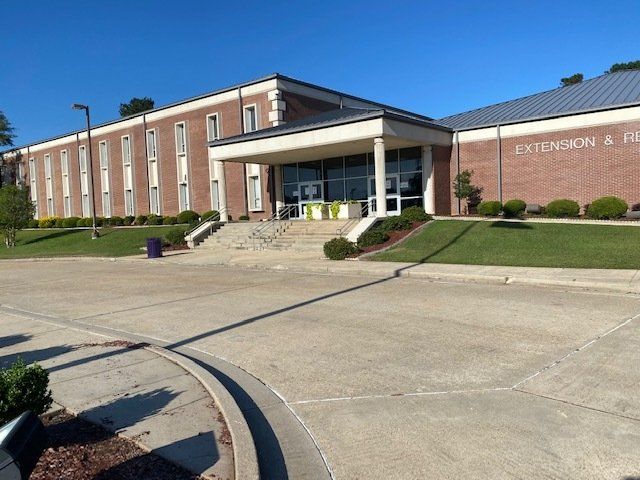 Brick building with entrance steps, labeled