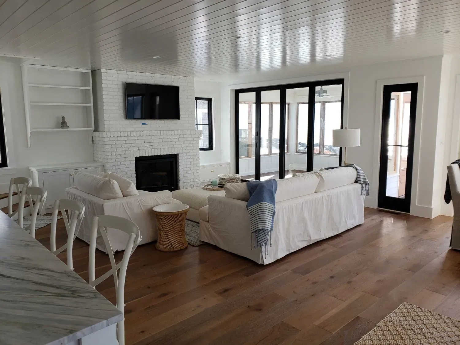 A living room filled with furniture and a fireplace.