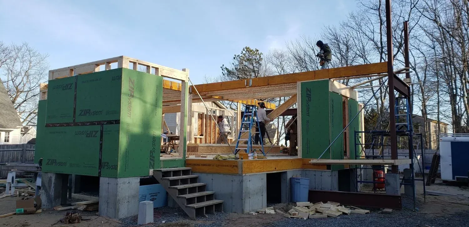 A house is being built with a lot of green walls.