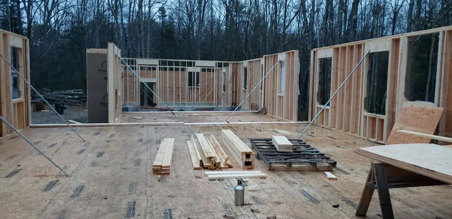 A house is being built in the middle of a forest.