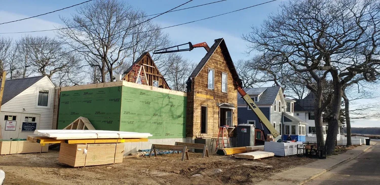 A house is being built in the middle of a residential area.