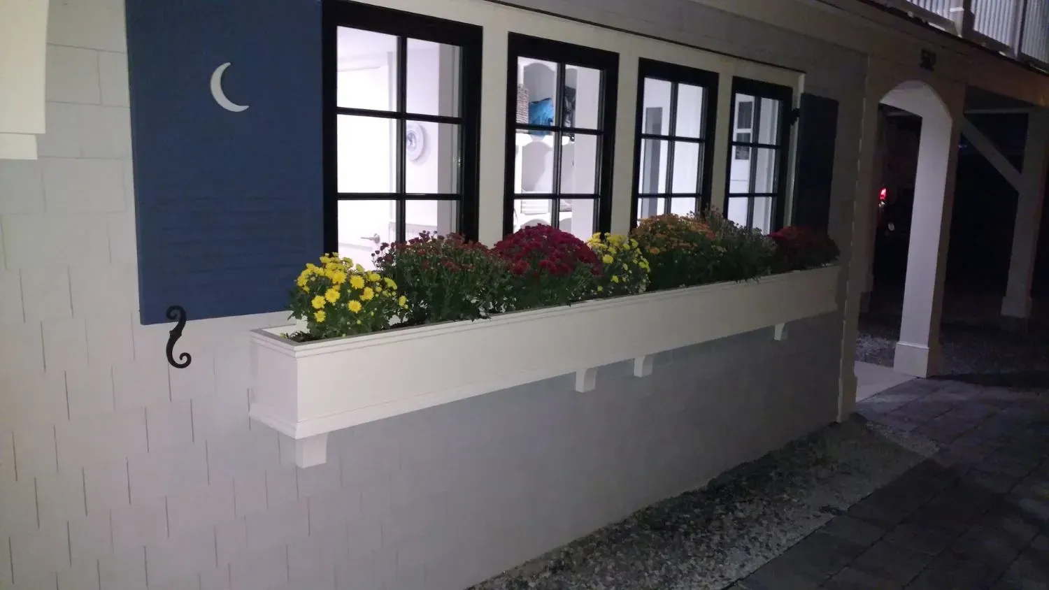 A window with a crescent moon painted on it