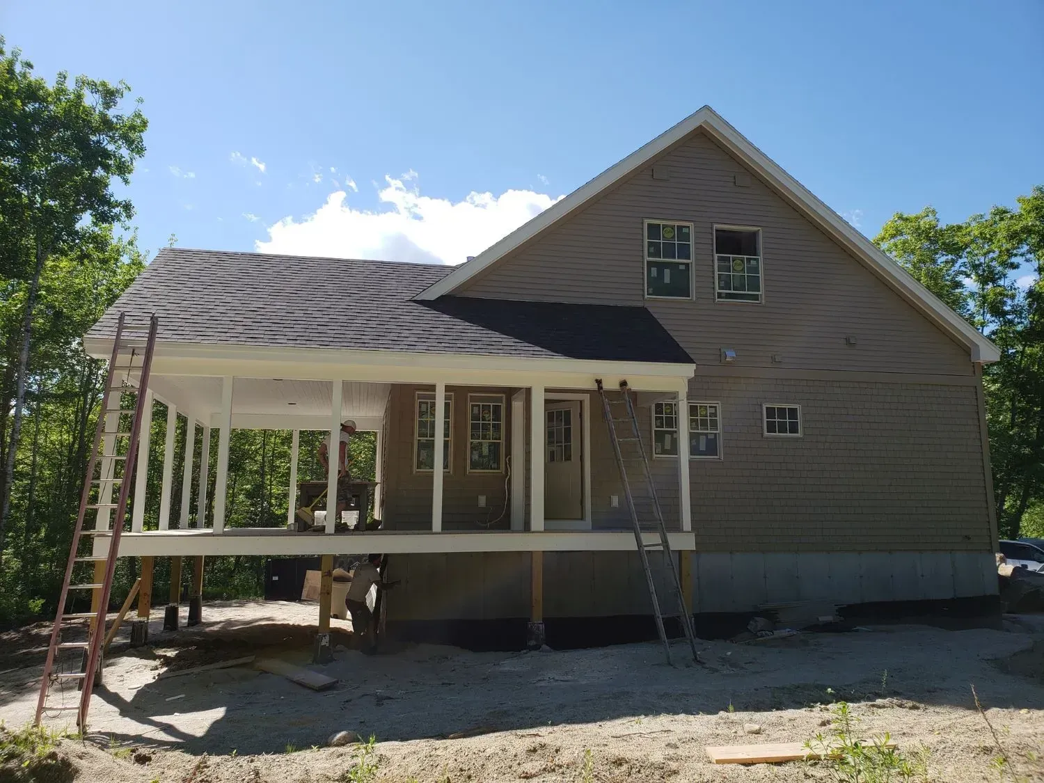 A house is being built on stilts with a porch.
