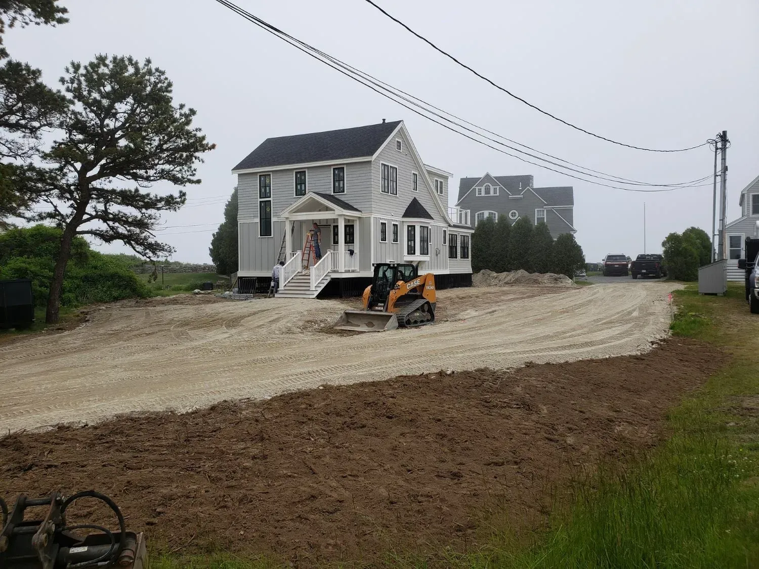 A house with a bulldozer in front of it