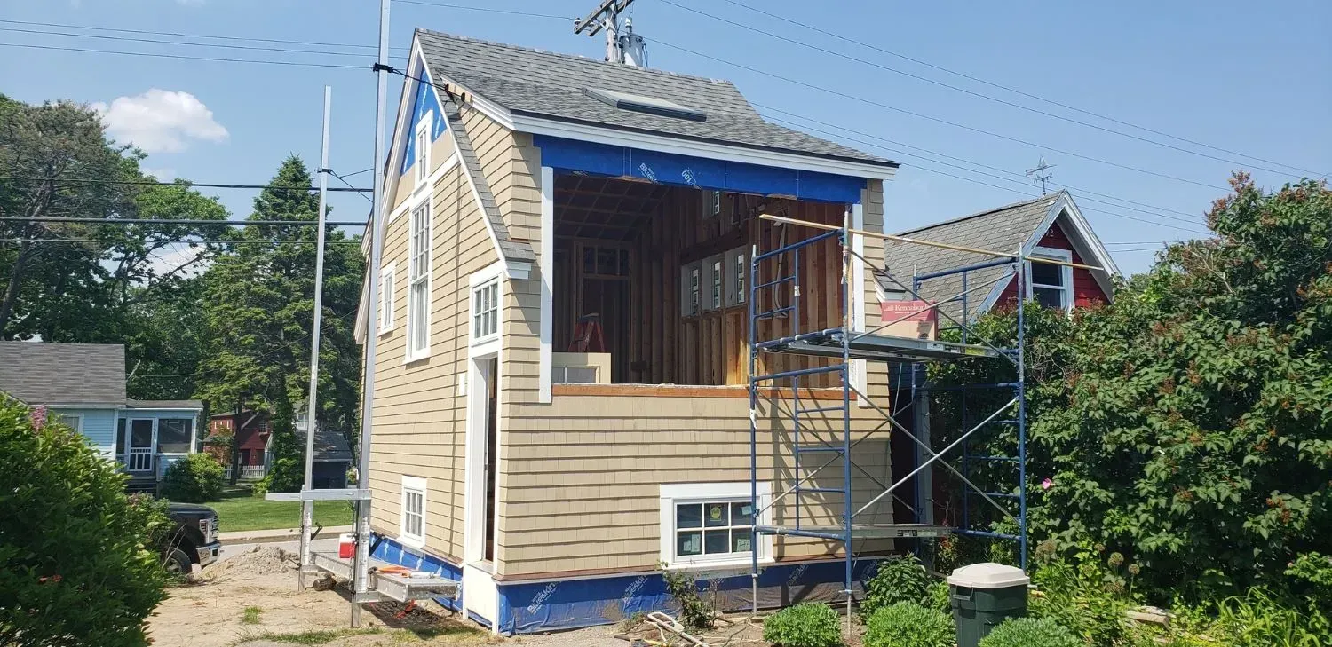 A house is being remodeled in a small town.