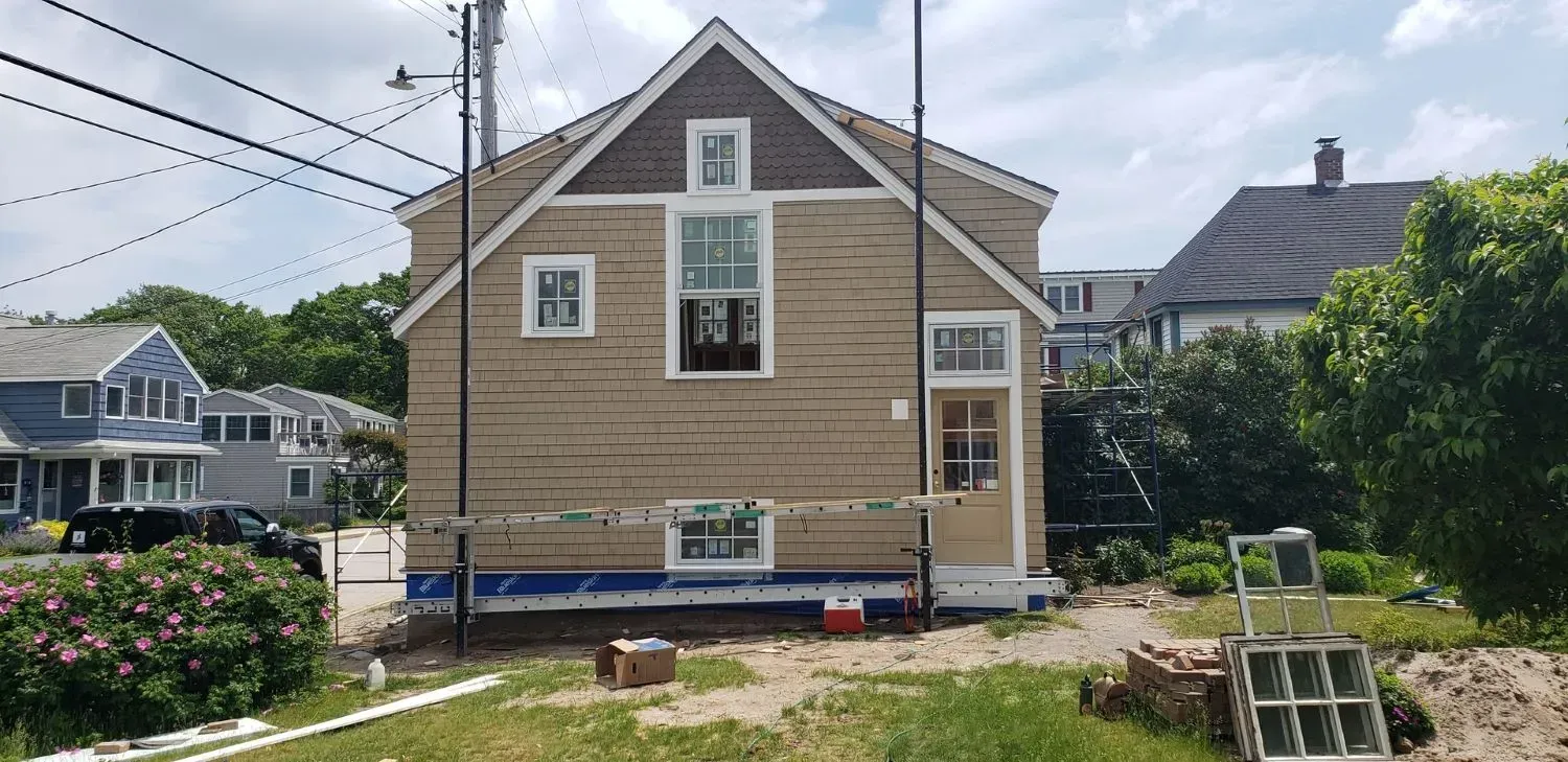 A house is being built in the middle of a residential area.