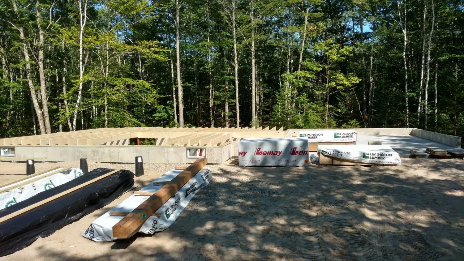 A house is being built in the middle of a forest.