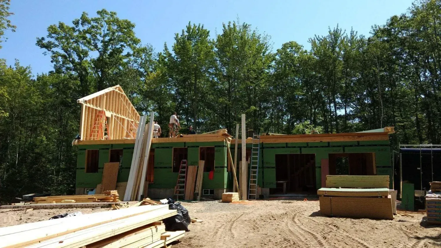 A house is being built in the middle of a forest.