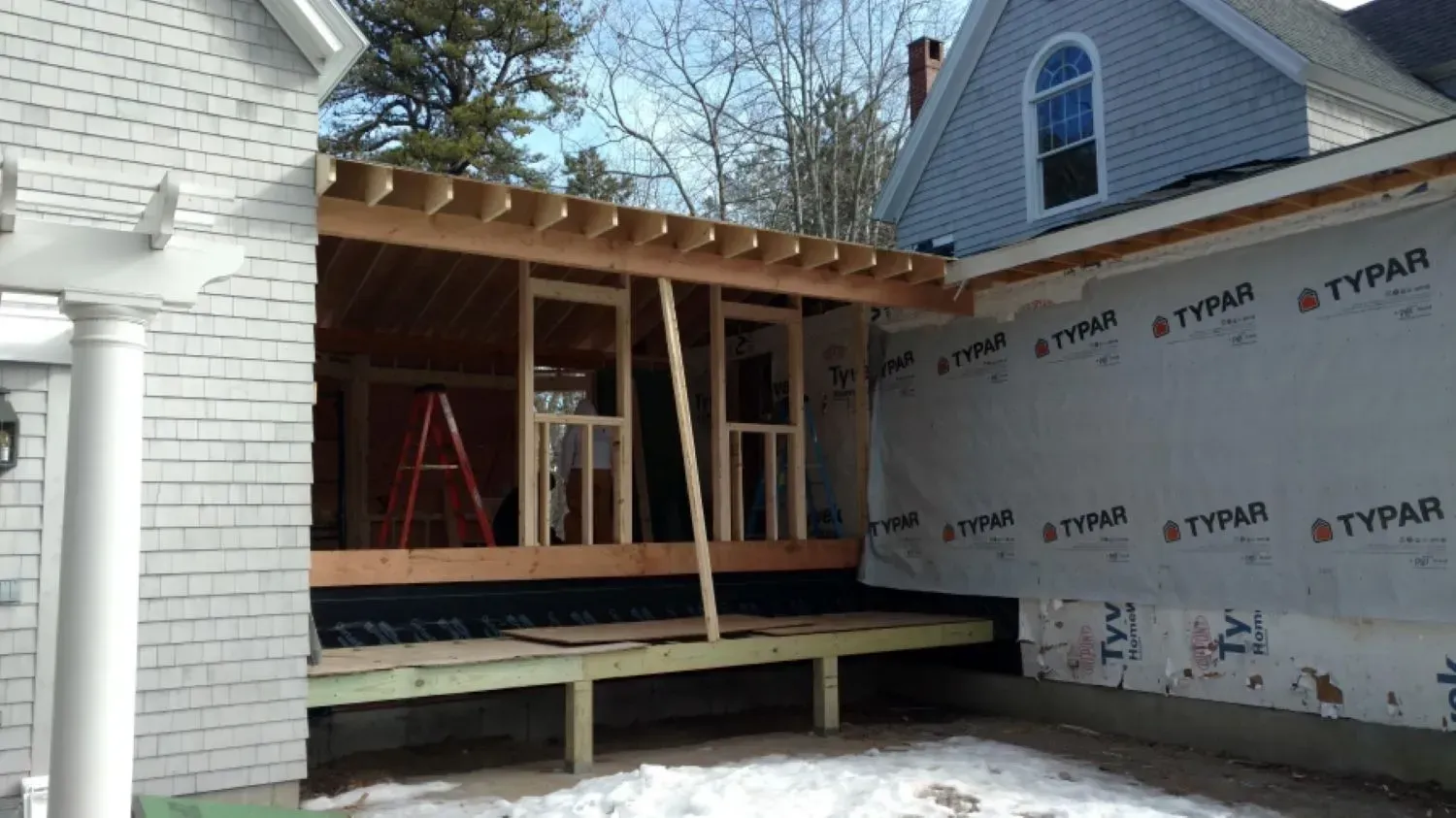 A house that is being built with styrofoam on the side