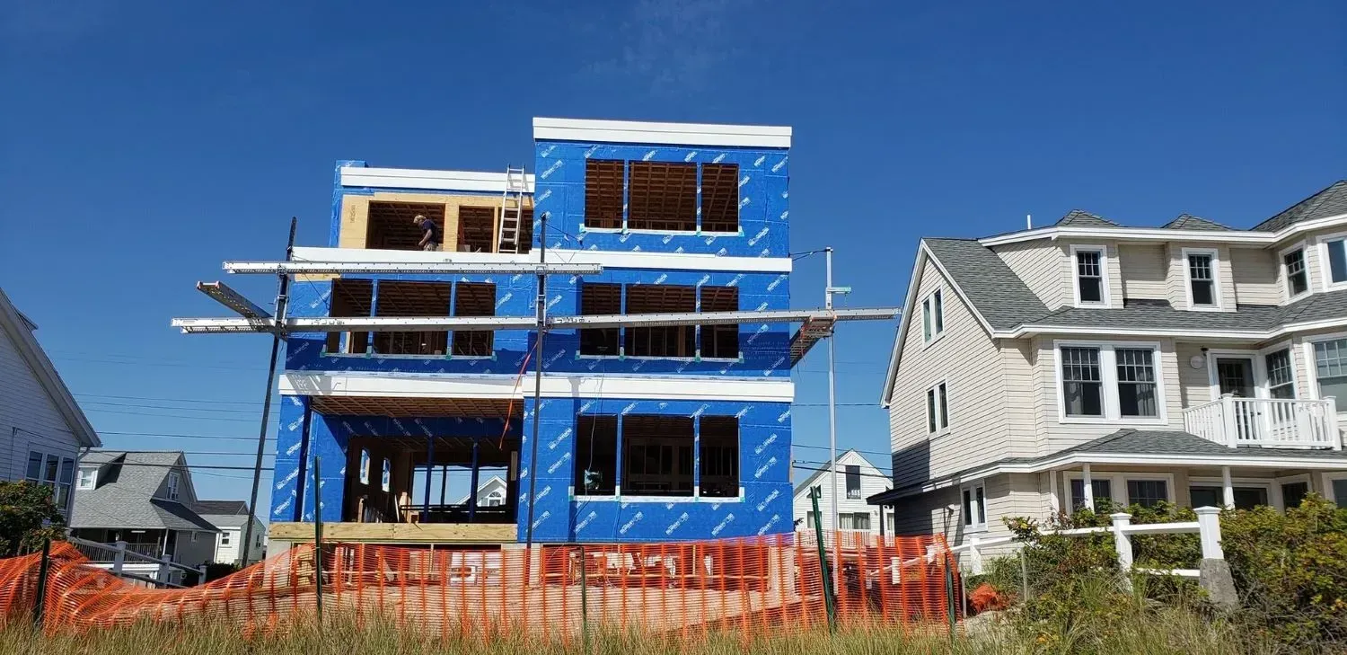 A house is being built in a residential area.