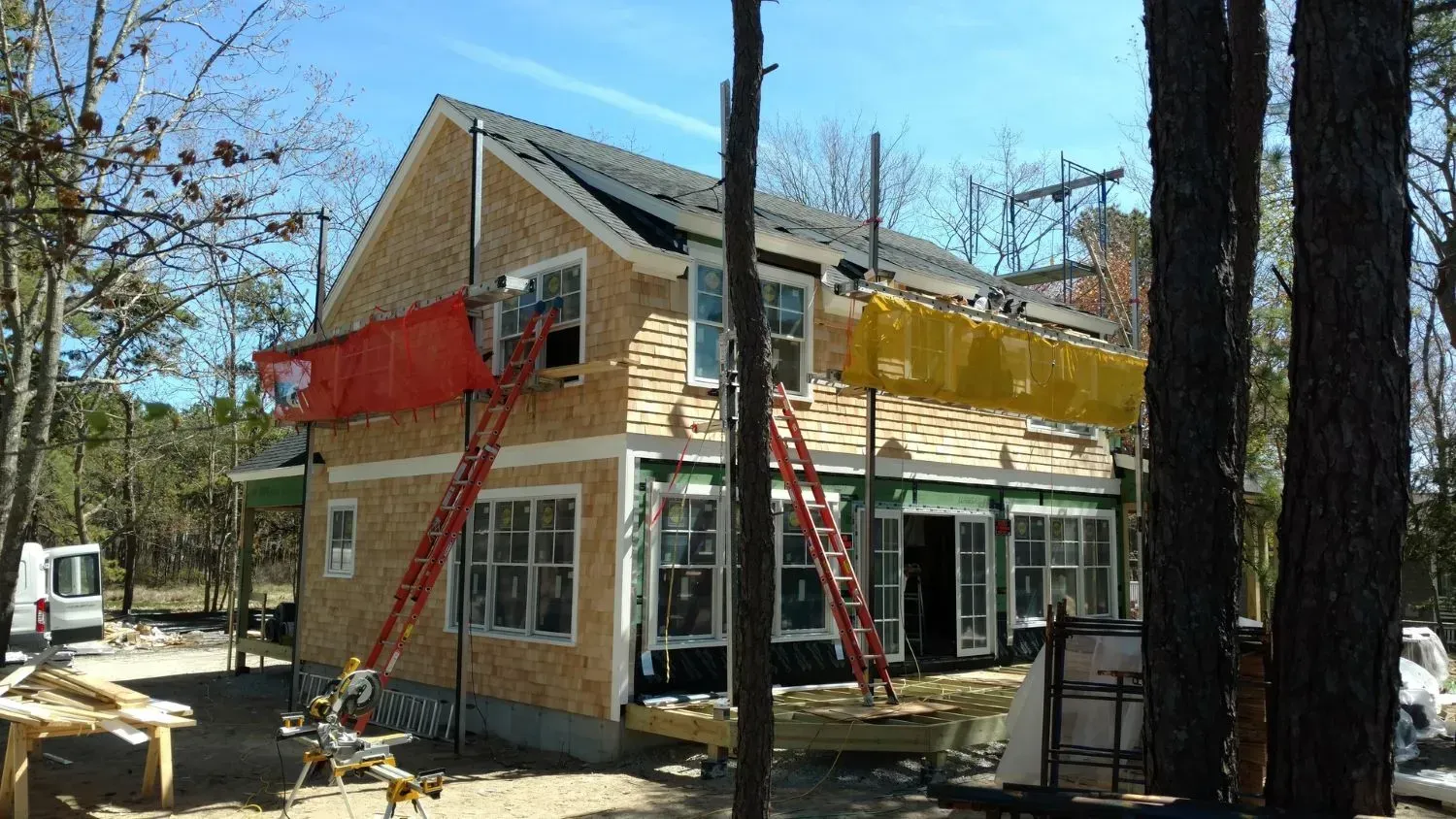 A house is being built in the middle of a forest.