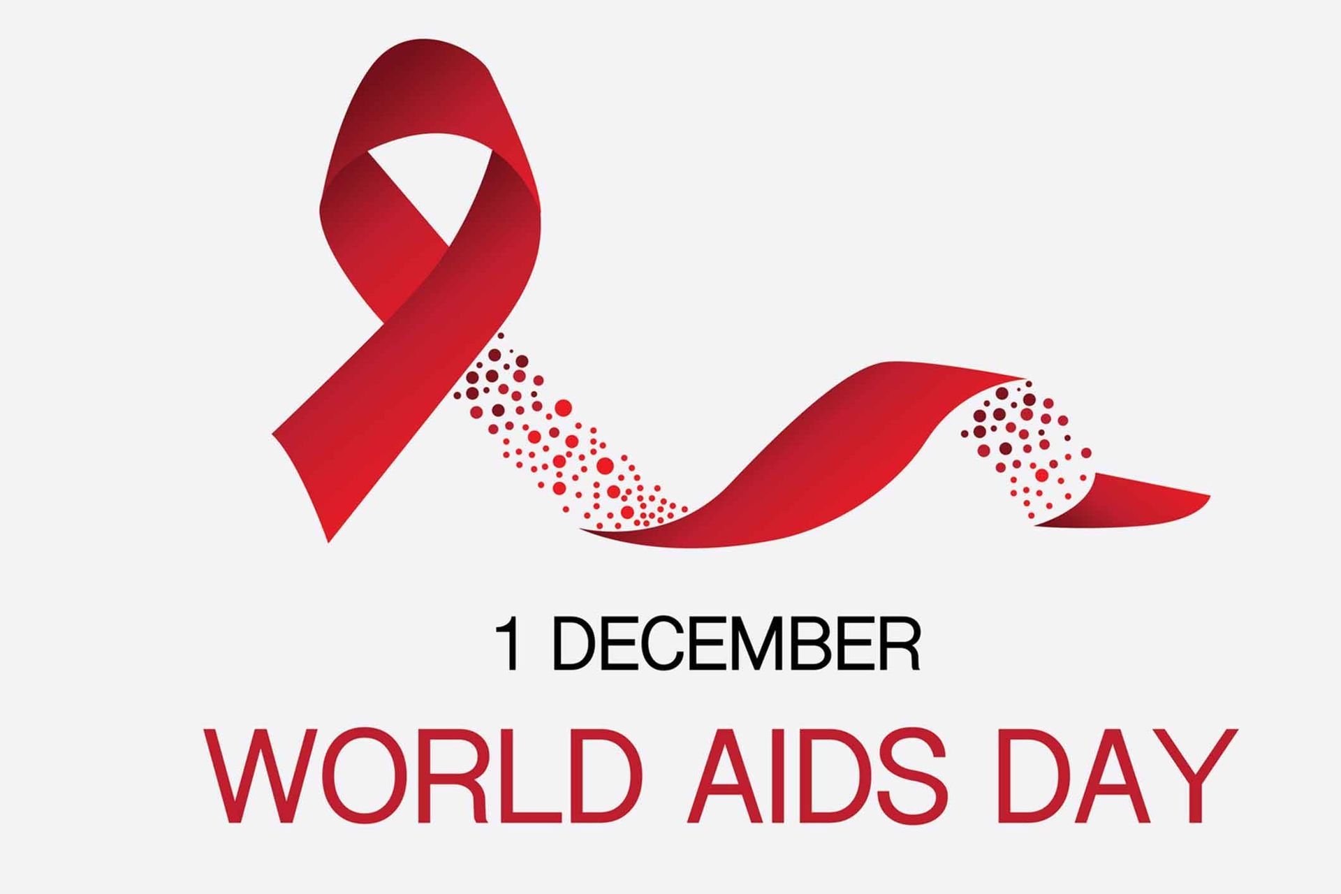 A red ribbon is on a white background for World Aids Day.