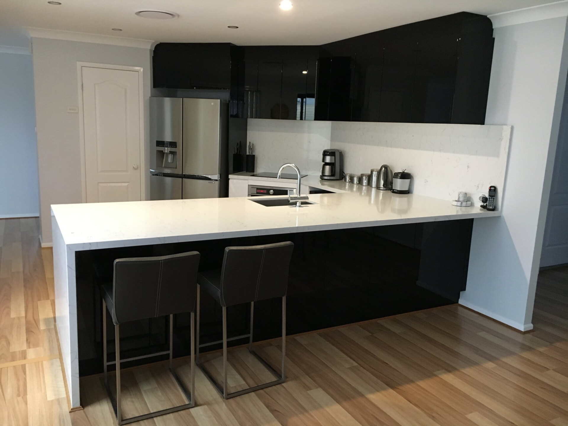Black Modern Kitchen With Appliances — Kitchen Designer in Gosford, NSW