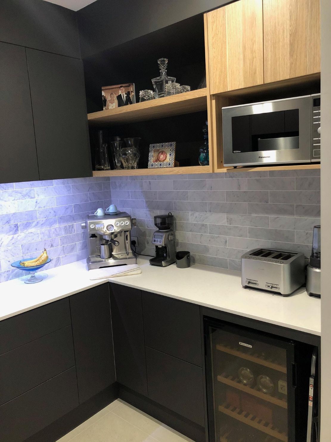 Black Modern Kitchen With Kitchen Appliances — Kitchen Designer in Morisset, NSW