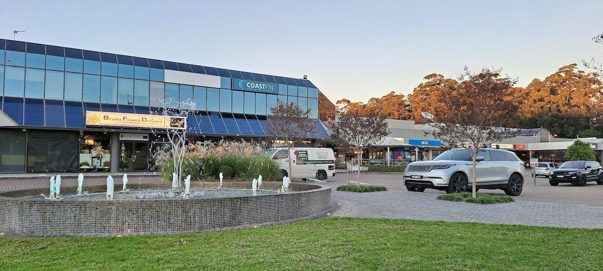 Erina With Fountain In Parking Lot — Kitchen Designer in Erina, NSW