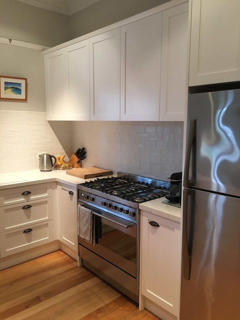 New Modern Kitchen With Gas Range And White Cabinets — Kitchen Designer in Central Coast, NSW