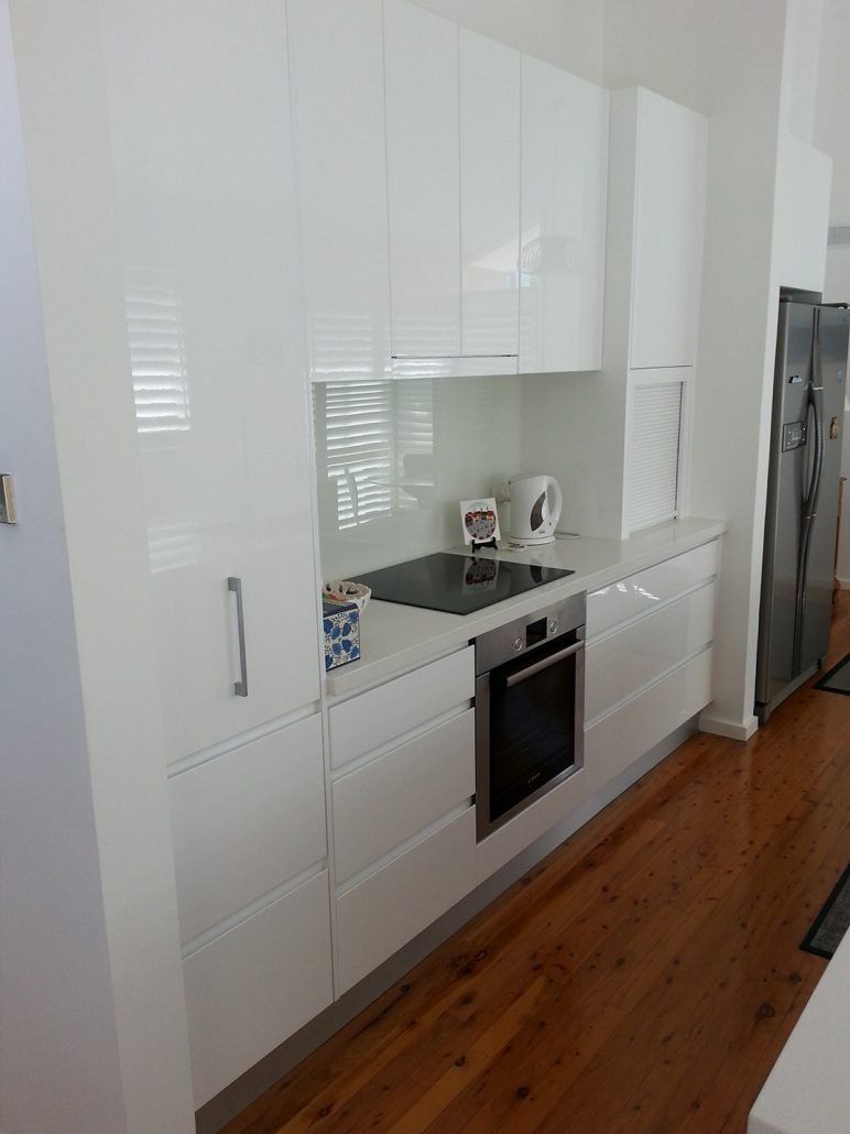 New Home Kitchen White Cabinets With Induction Cooktops — Kitchen Designer in Newcastle, NSW