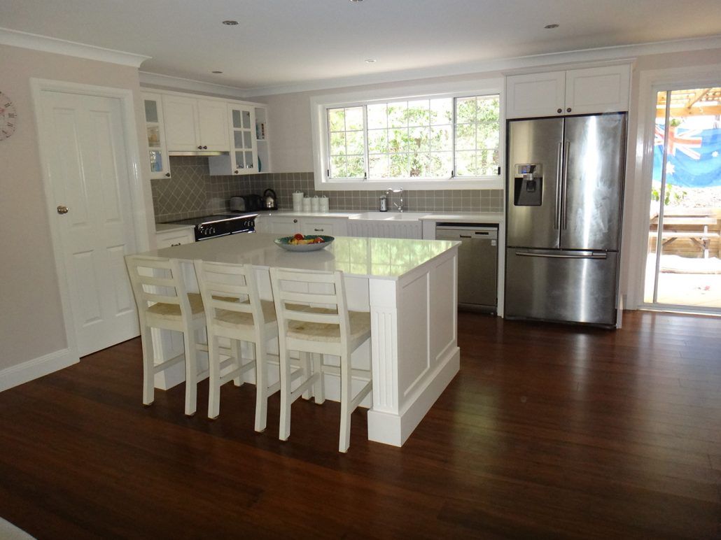 New Kitchen With Island Counter And White Bar Stools — Kitchen Designer in Belmont, NSW