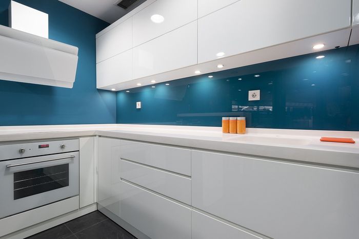 Kitchen Worktops And Blue Splashbacks — Kitchen Designer in Charmhaven, NSW