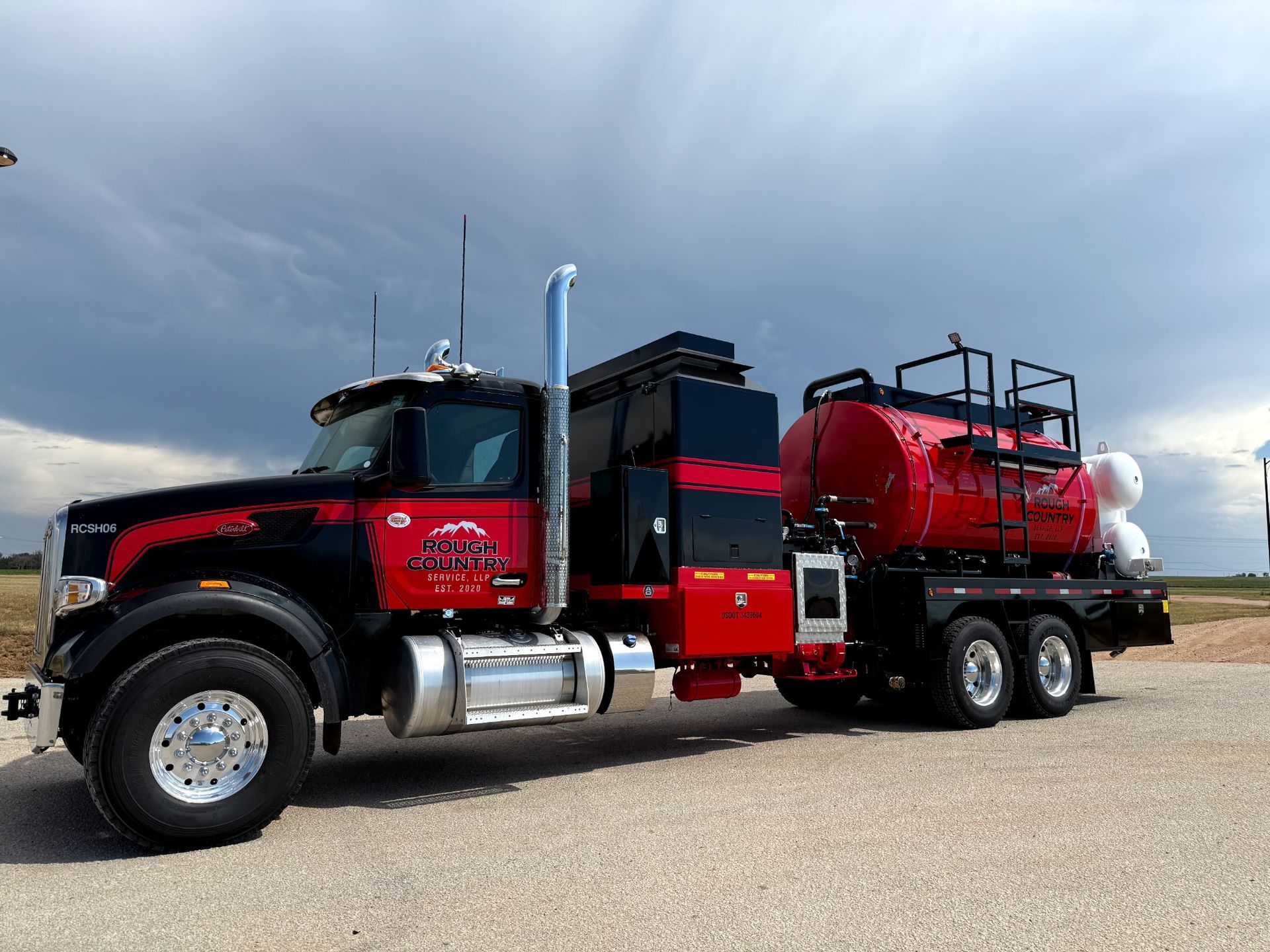 A white water truck is parked in a warehouse.