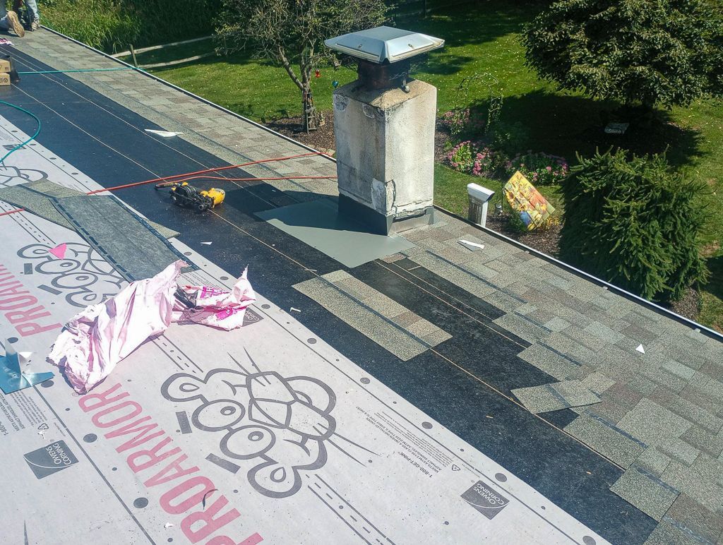 An aerial view of a roof with a chimney on it
