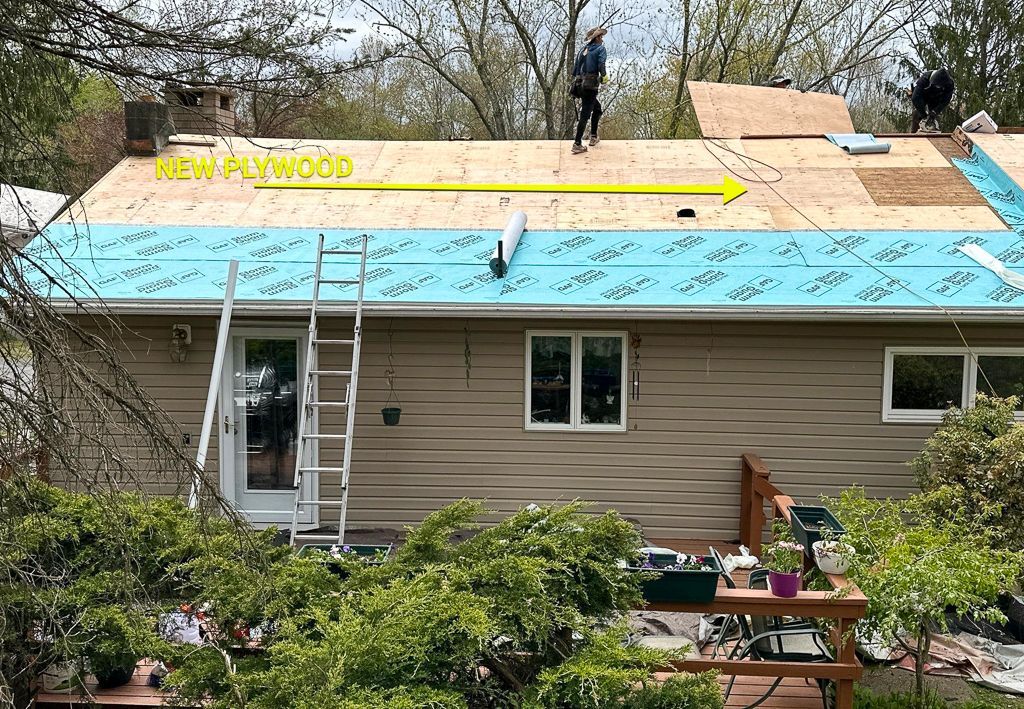 A house is being remodeled with a new roof being installed.