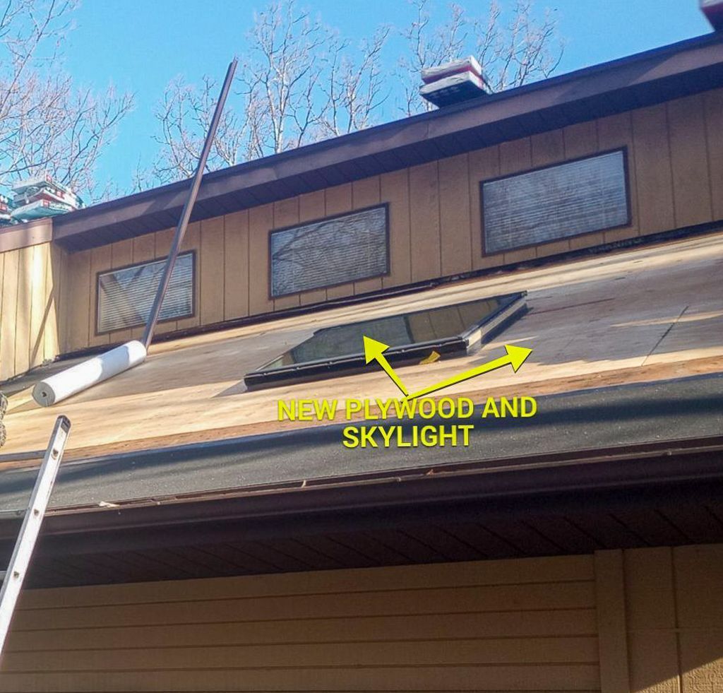 A picture of a roof that says new plywood and skylight