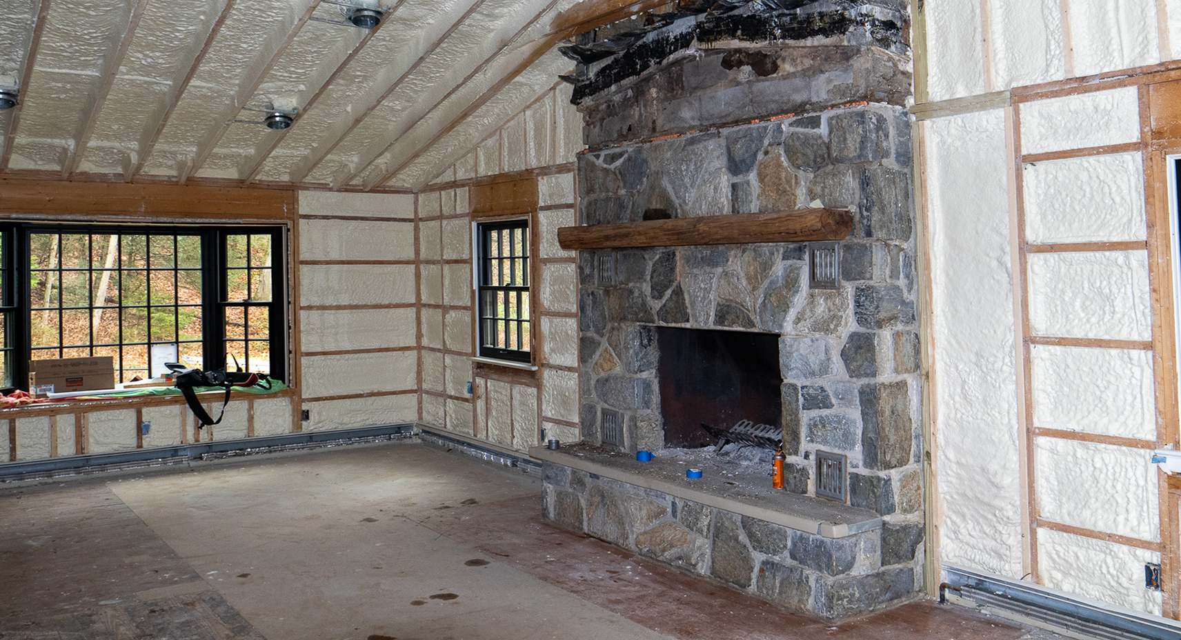There is a fireplace in the middle of the room.