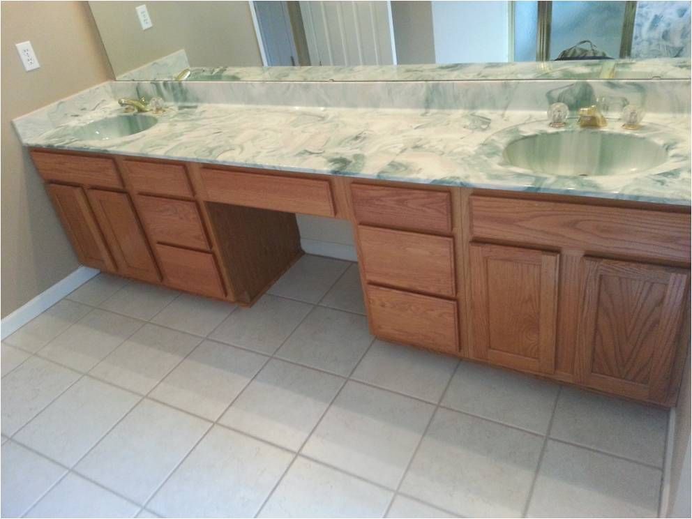 A bathroom with two sinks and a large mirror