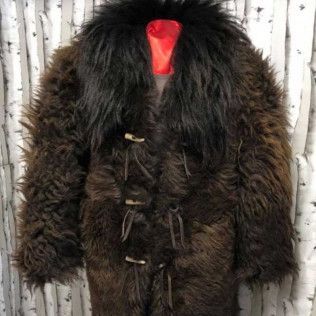 A brown fur coat with a black collar is on a mannequin.