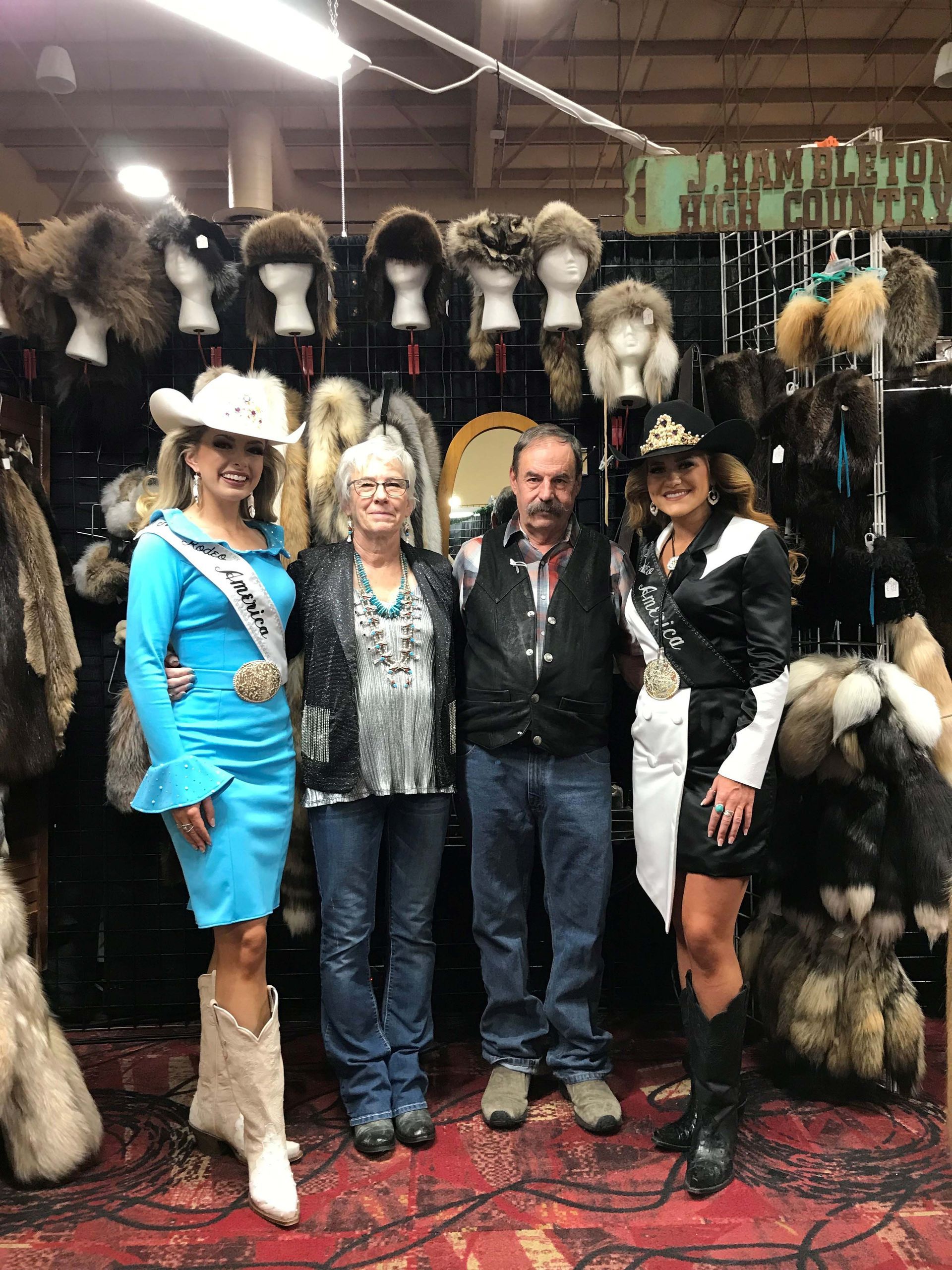 A group of people standing next to each other in a room.