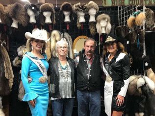 A group of people are posing for a picture in a store.