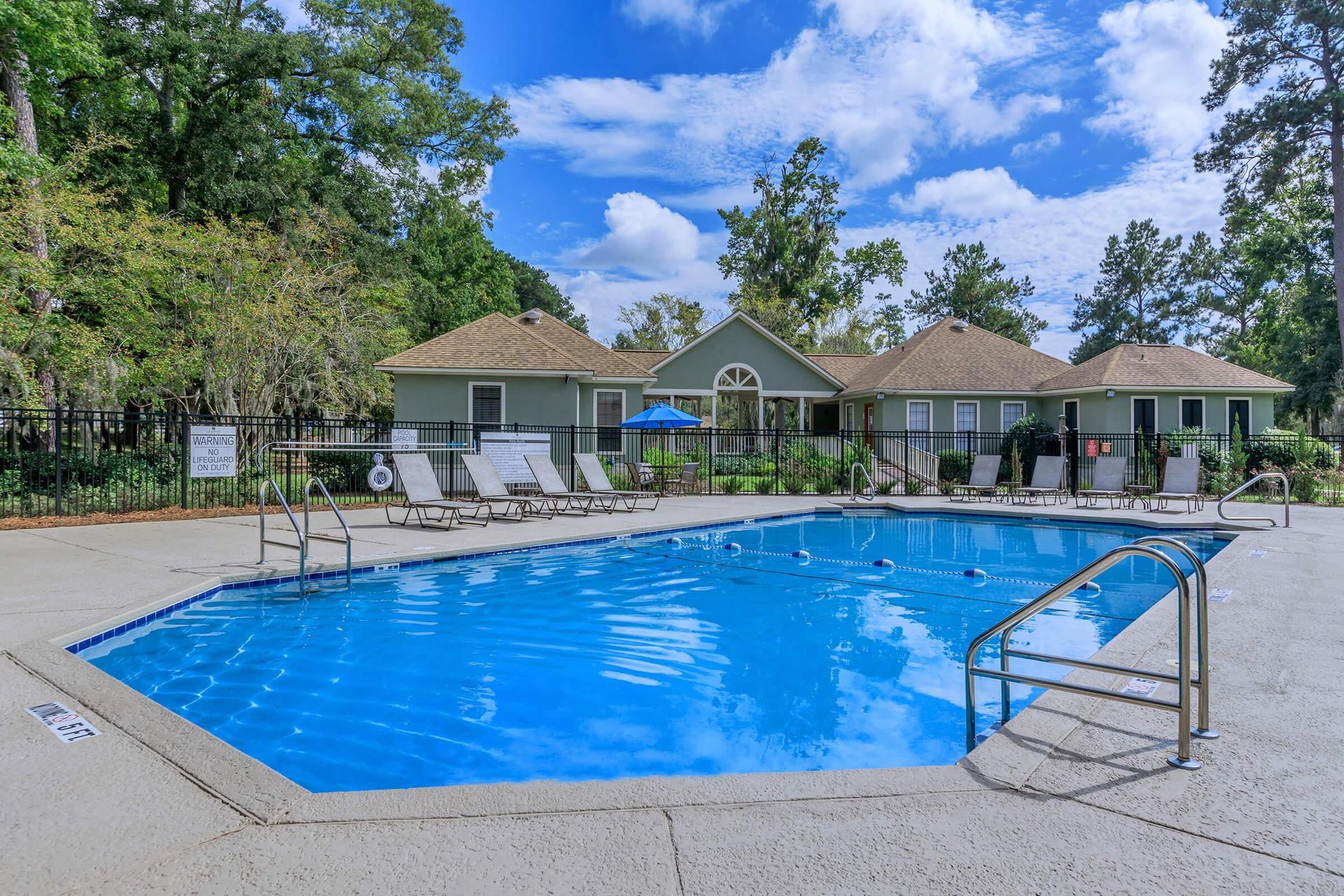 Outdoor swimming pool at The Arbors in Garden City, GA.