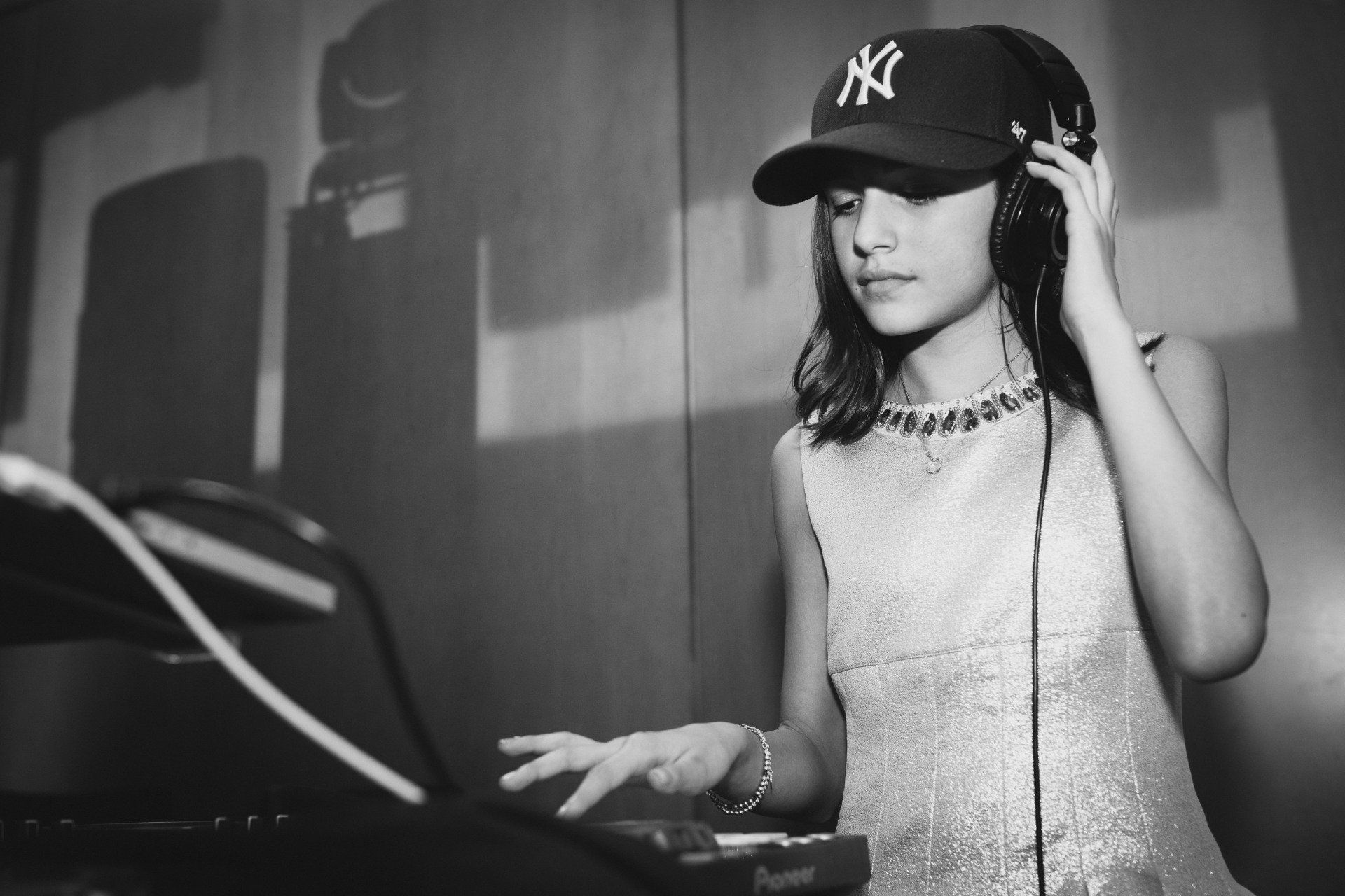 Portrait photo of a girl playing DJ