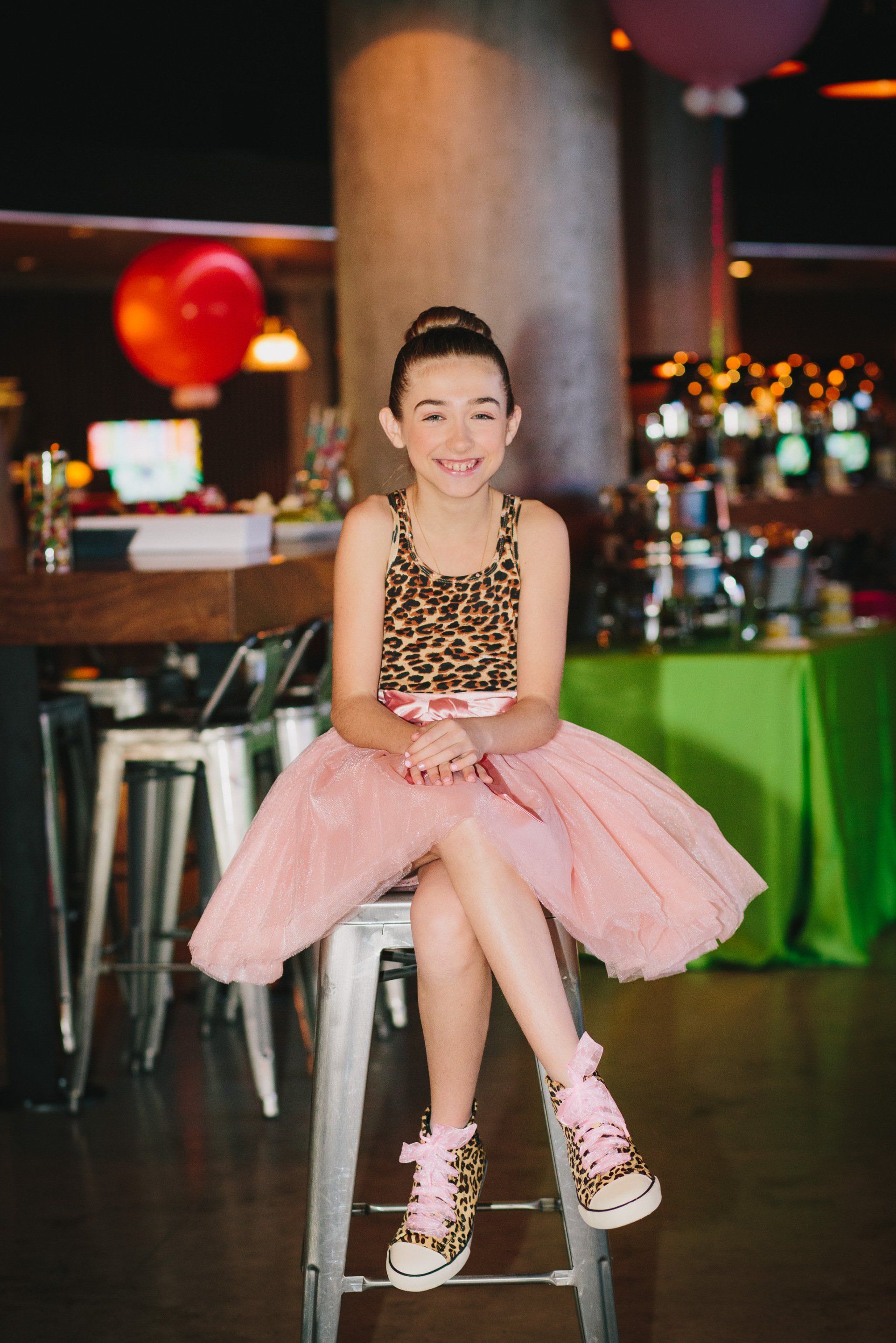 A girl sitting at her bat miztvah