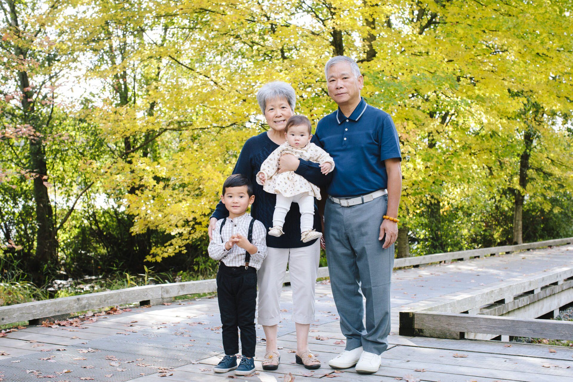 Family photo of grandparents and grandchildren in the park