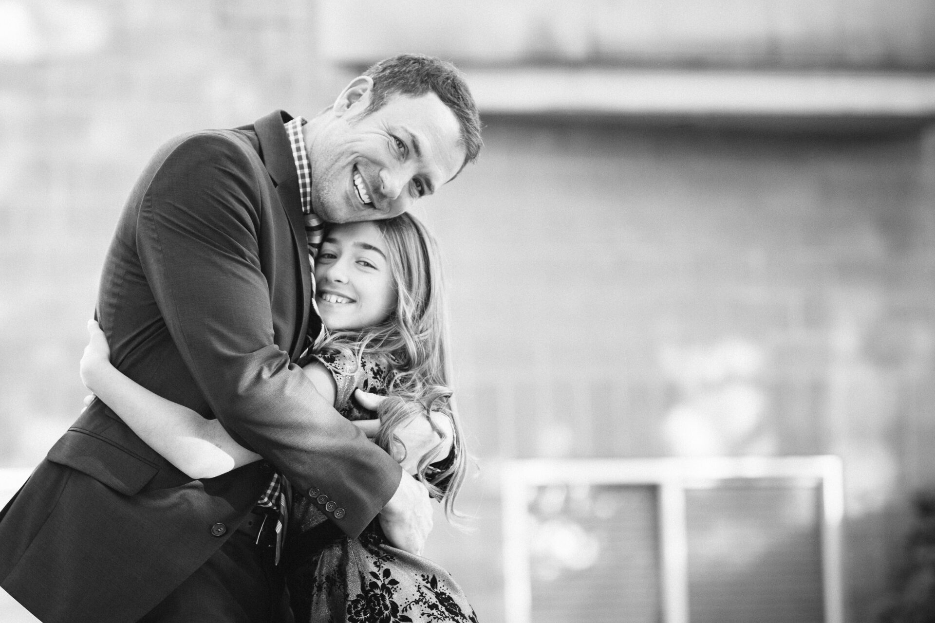 Family photo of a father hugging his daughter