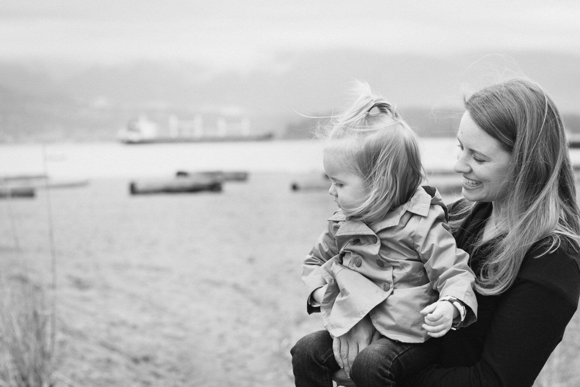 Portrait photo of a mother holding her daughter