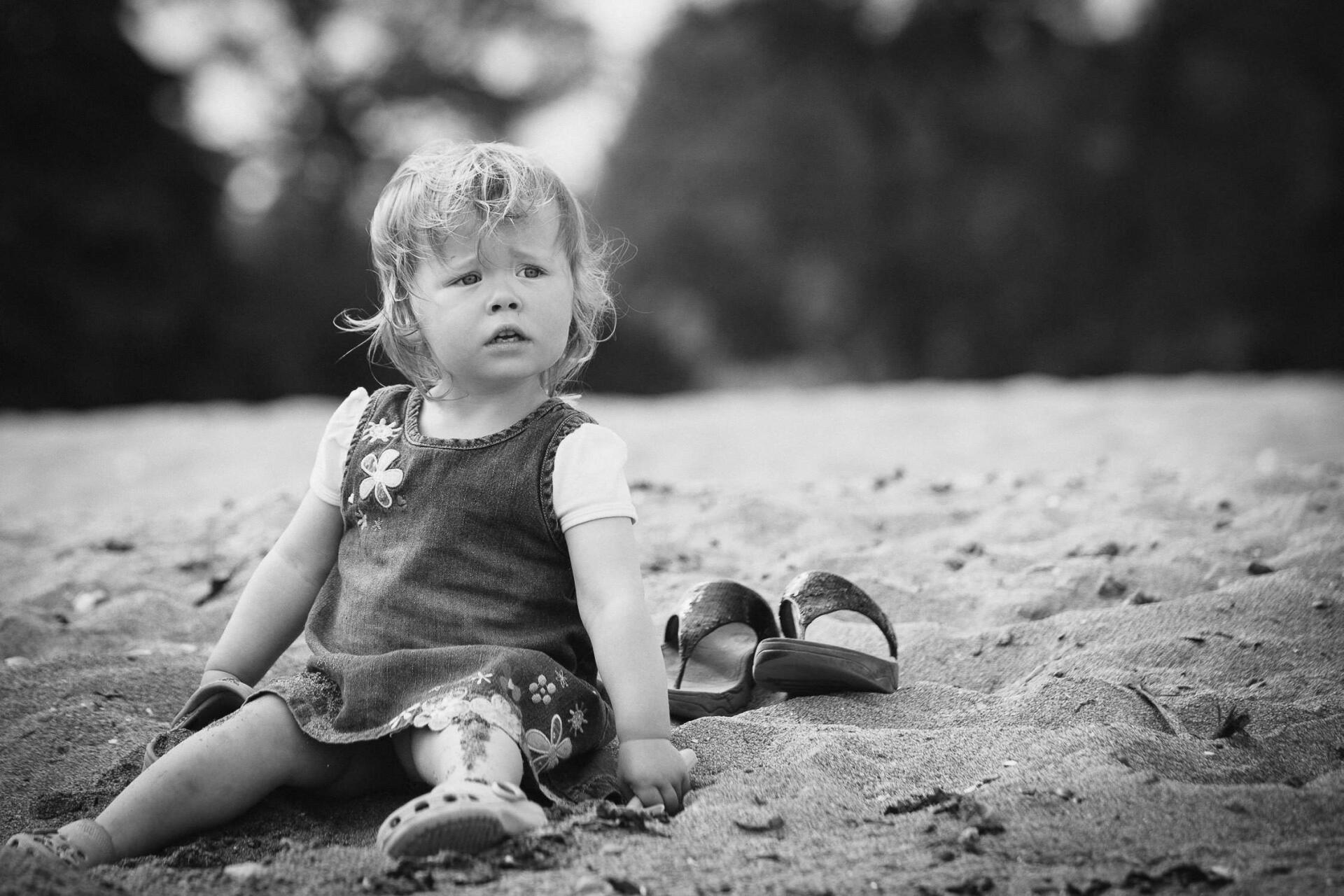 Portrait photo of a young child on the beach