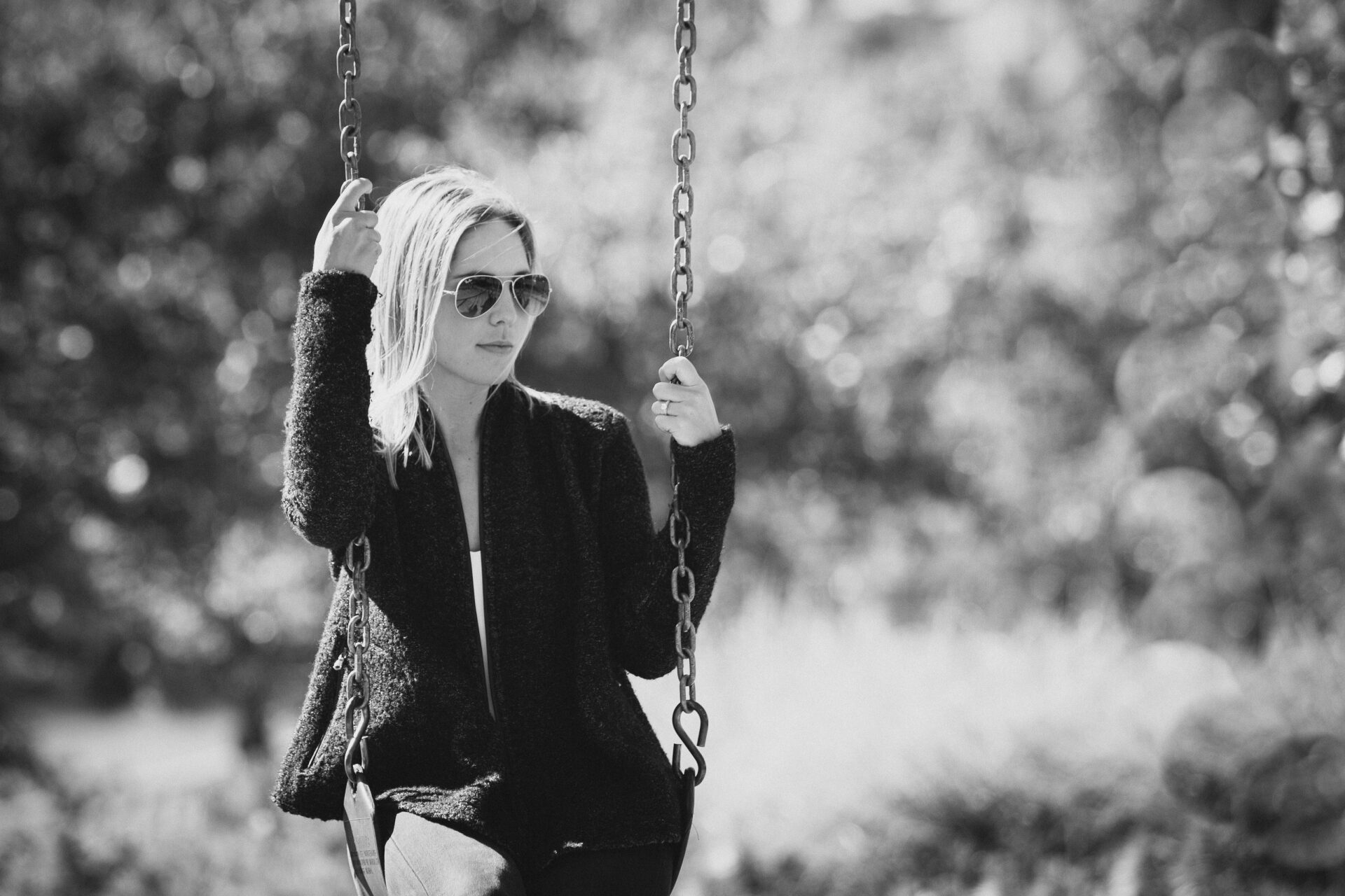 Portrait photo of a woman on a swing