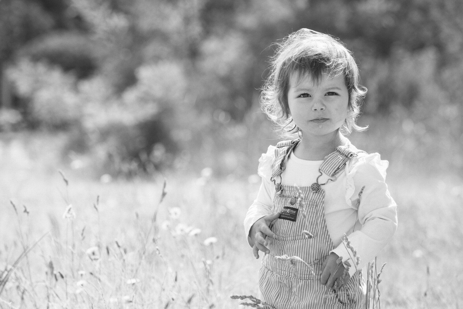 B&W photo of a young child outdoors